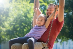 Girl and Father on Swing